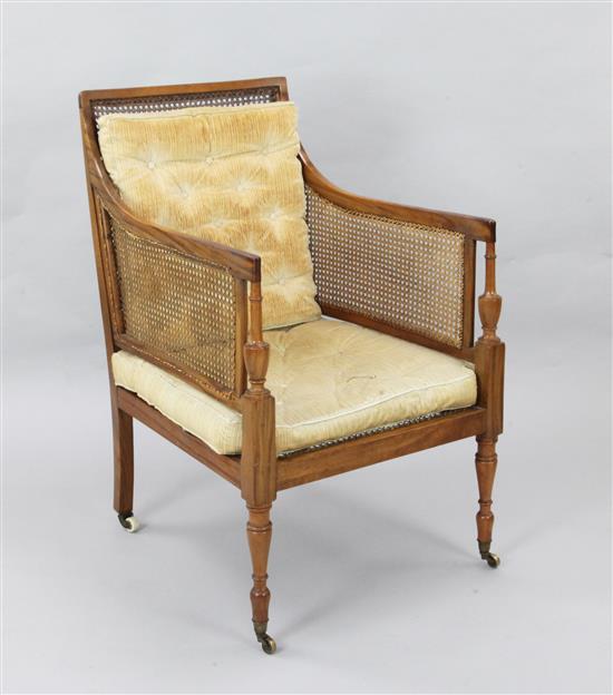An Edwardian Sheraton style satinwood bergere armchair, W.2ft D.2ft 5in. H.3ft 3in.